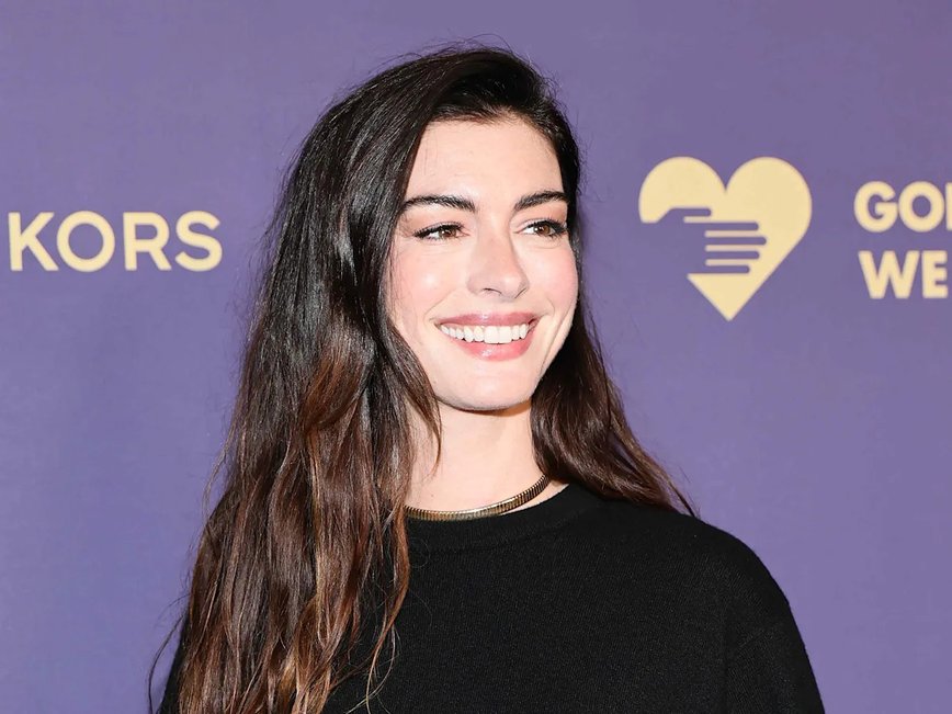 Anne Hathaway Stuns in a Daring Red Dress Held Together by Dainty Bows