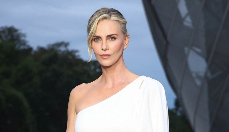 Charlize Theron Wows in Lacy Catsuit Tribute to Jerry Hall