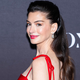 Anne Hathaway Dazzles with Bold Tomato Red and Fuchsia Combo
