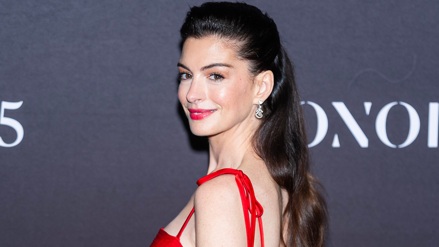 Anne Hathaway Dazzles with Bold Tomato Red and Fuchsia Combo