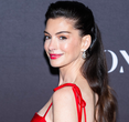 Anne Hathaway Dazzles with Bold Tomato Red and Fuchsia Combo