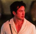 Hudson Williams Turns Heads in a Plunging Linen Top and Trendy Dad Sneakers