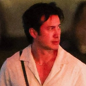 Hudson Williams Turns Heads in a Plunging Linen Top and Trendy Dad Sneakers