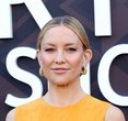 Kate Hudson Steals the Spotlight in Daring Orange Gown at Star-Studded Premiere