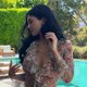 Kylie Jenner's Easter Glam: Vintage Dior, Rolled Jeans, and a Dazzling Belly Chain